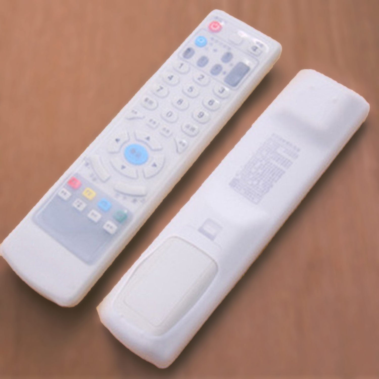 Clear DISH TV remote cover securely fitted over a set-top box remote control.
