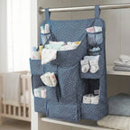 Close-up of storage pockets in baby care organizer for bottles and lotions
