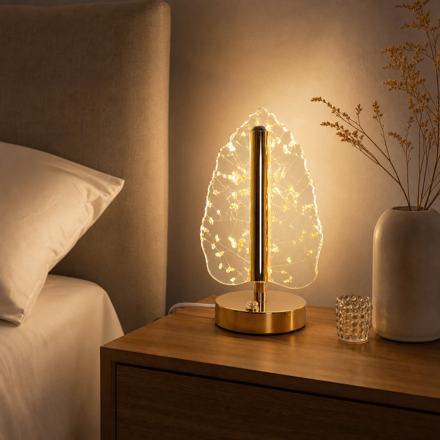 Bedside setup with golden crystal leaf LED table lamp creating warm light ambiance
