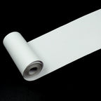 A thermal printer paper roll showcasing a crisp, clear black and white printed image.