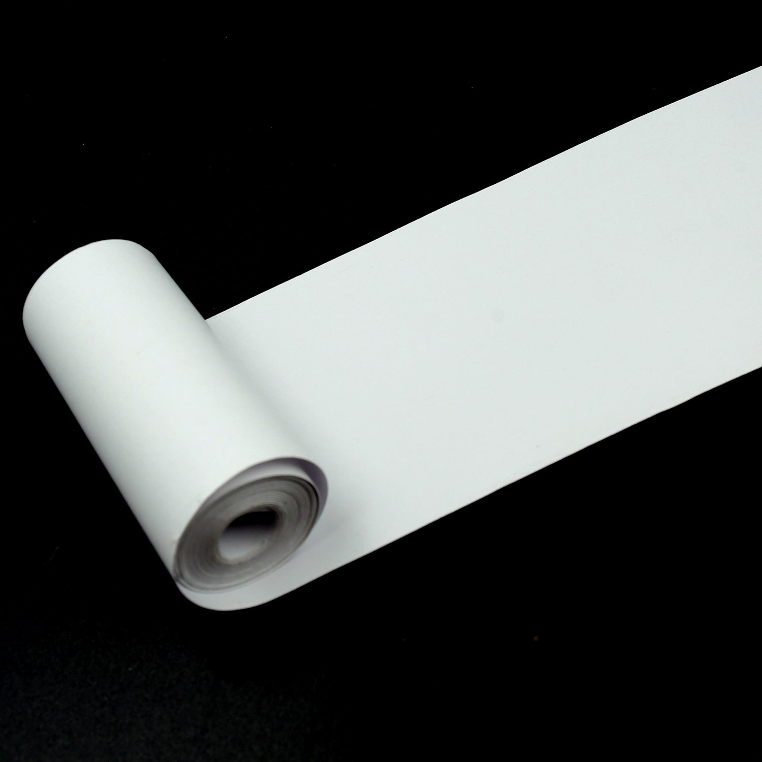 A thermal printer paper roll showcasing a crisp, clear black and white printed image.
