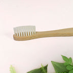 Angled view of sustainable bamboo toothbrush highlighting design and structure