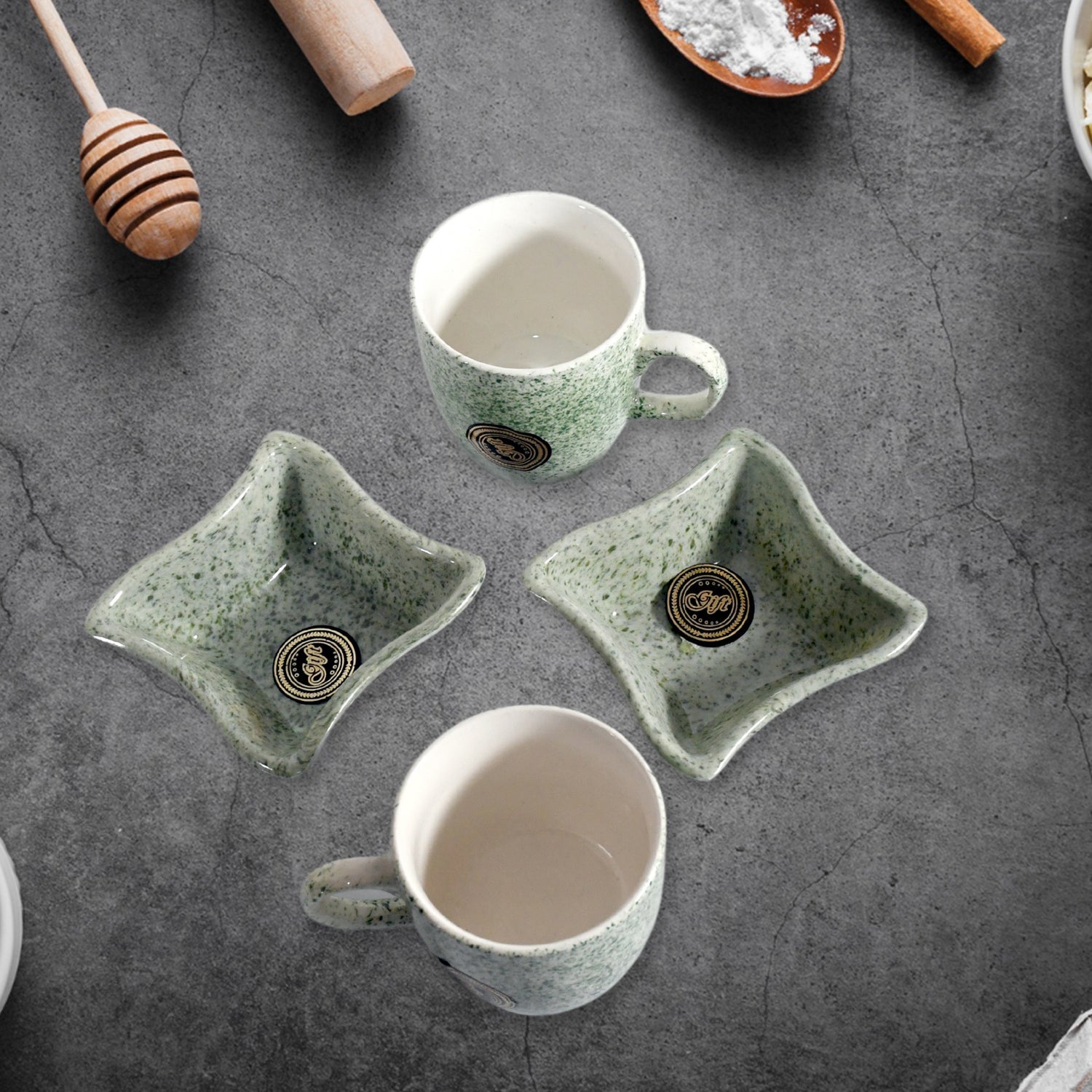 A person enjoying chai and snacks with the versatile ceramic tea and coffee cup set.