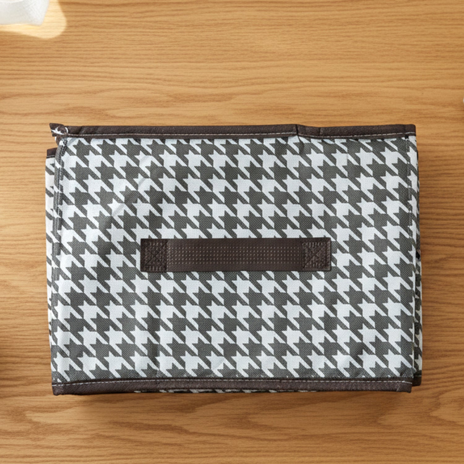 Foldable fabric storage basket in flat position