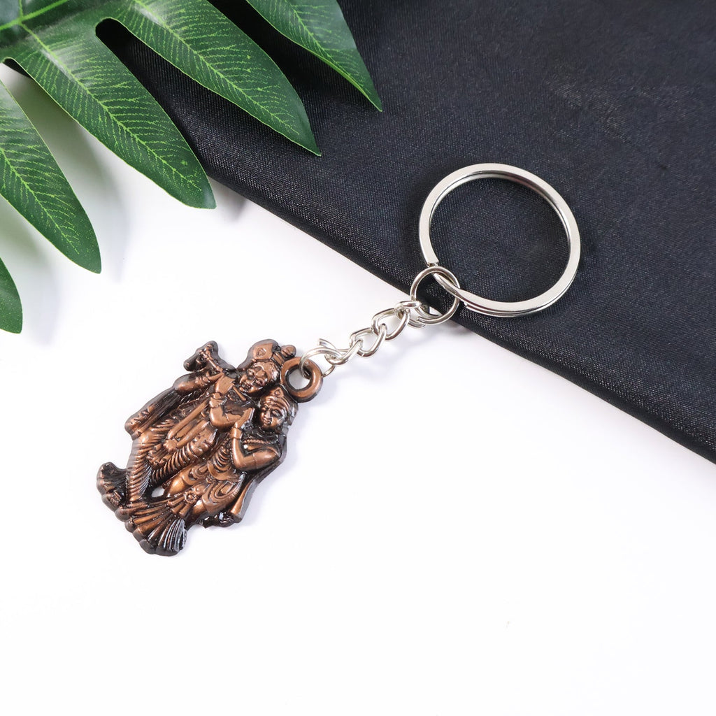 Radha Krishna metal keychain with antique finish and intricate design