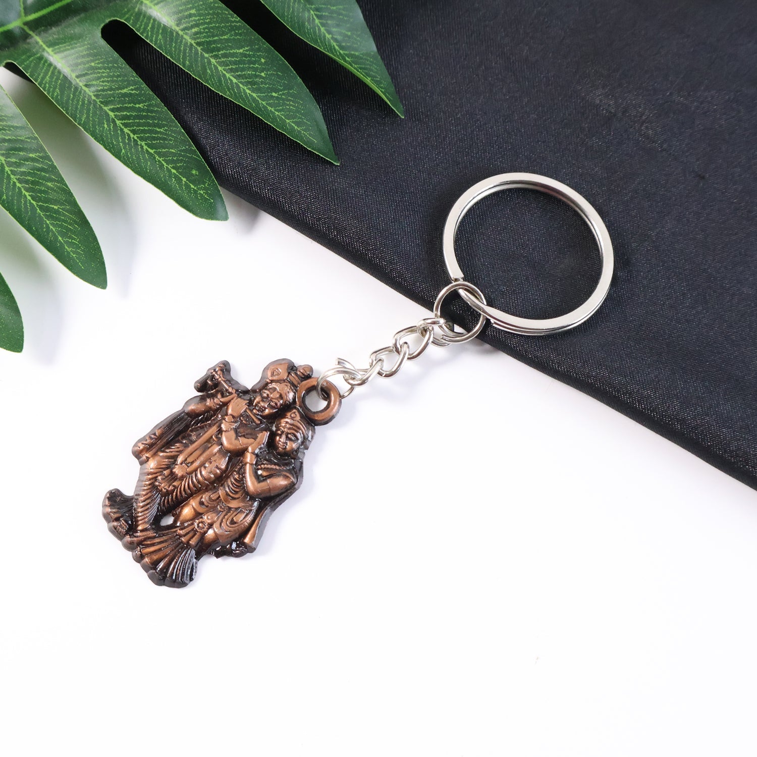 Radha Krishna metal keychain with antique finish and intricate design