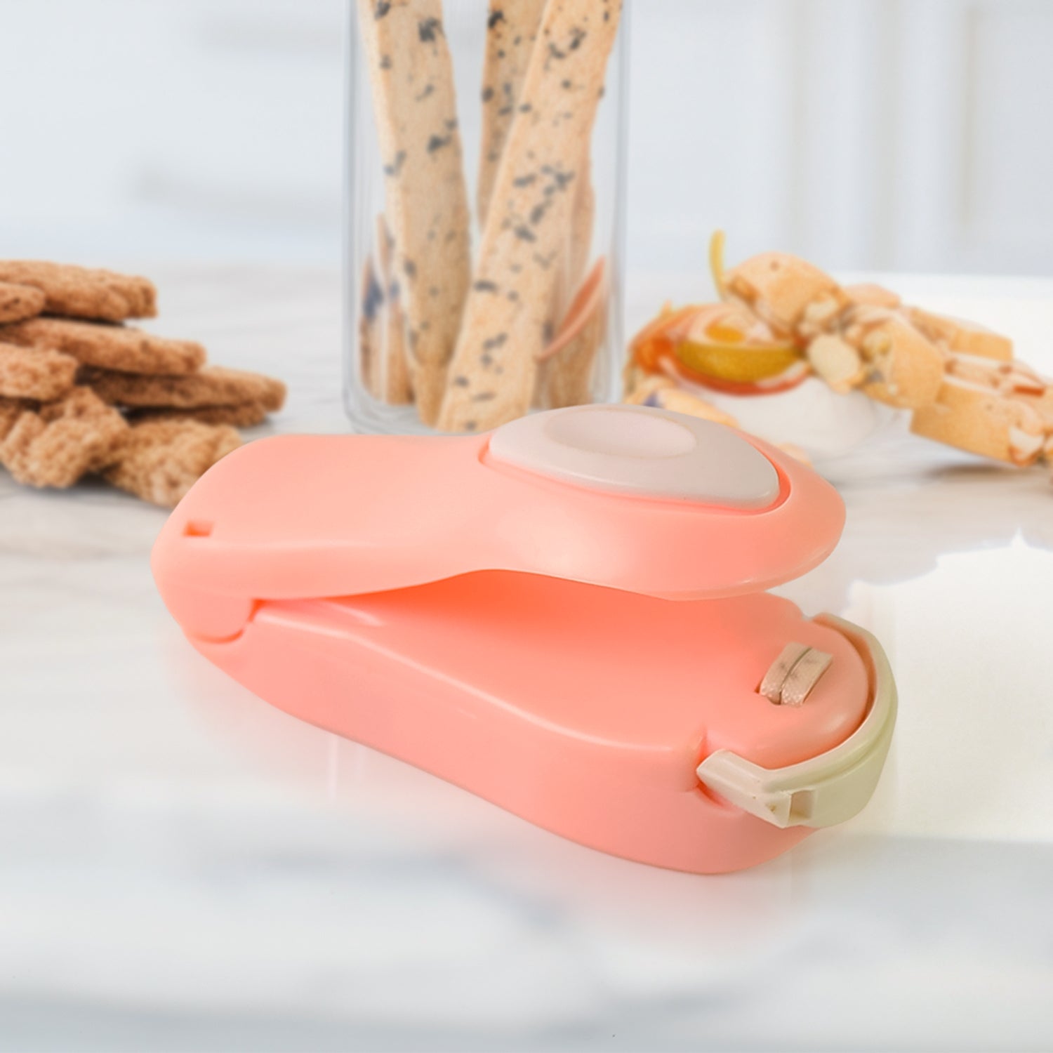 Mini heat sealer conveniently attached to a refrigerator with its magnetic back.