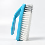 Kitchen cleaning tool, a versatile brush tackling dirt in a sink.