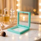 Transparent jewellery display box showing floating rings and earrings
