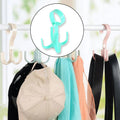 A 360-degree rotatable purse hanger hook with four claws, designed for efficient handbag storage.