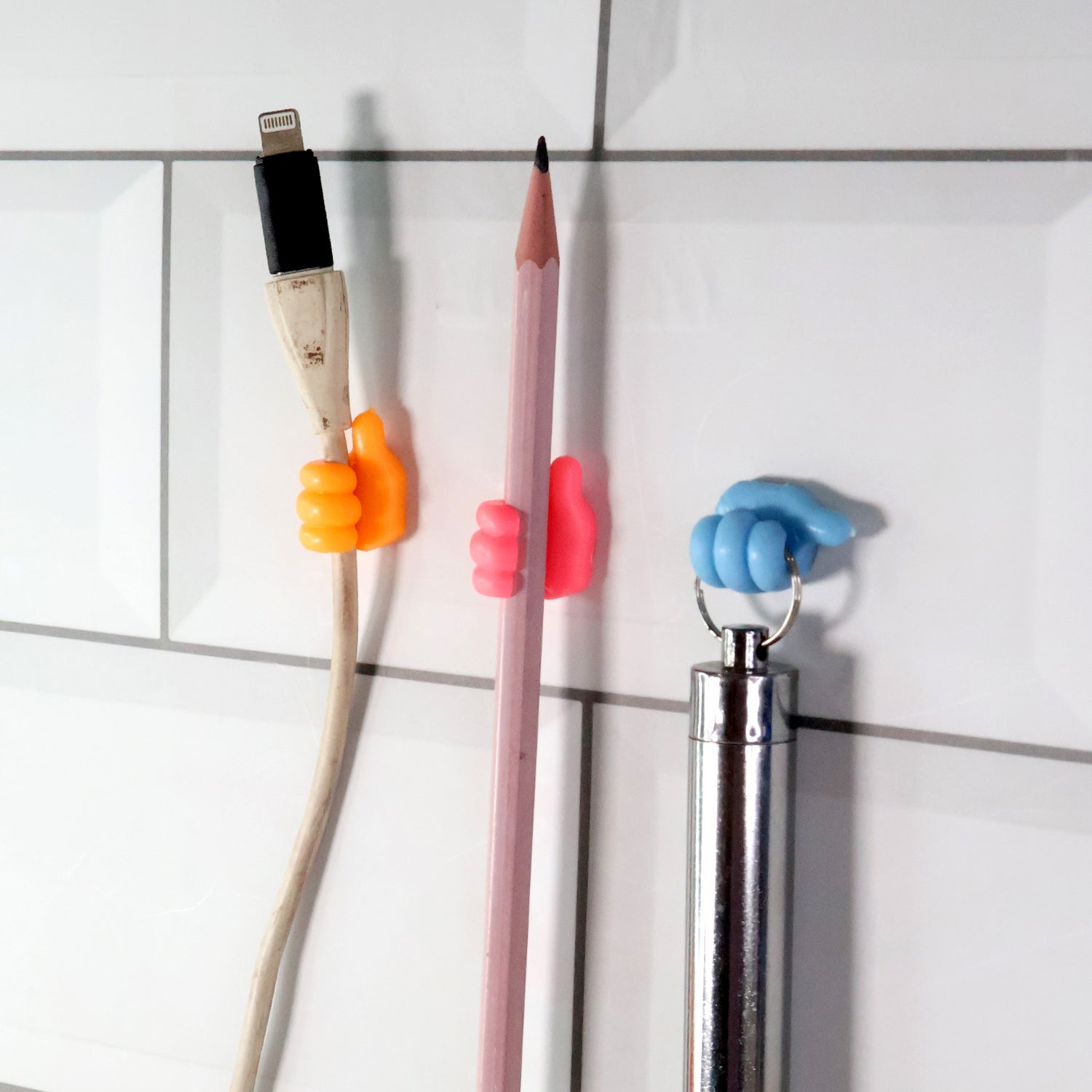 Various small items like socks and innerwear clipped onto mini utility hangers on a drying line.