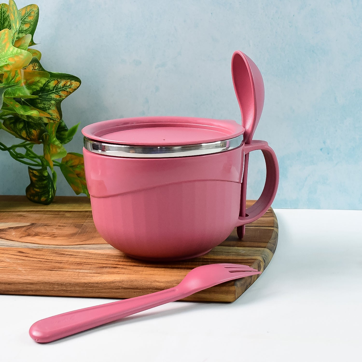 Angled view of Apex leak-proof noodle bowl with handle and included fork