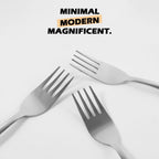 Stainless steel dinner forks featuring ergonomic handles for comfortable grip.