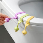 Person using the silicone toilet seat lifter for hands-free lifting.