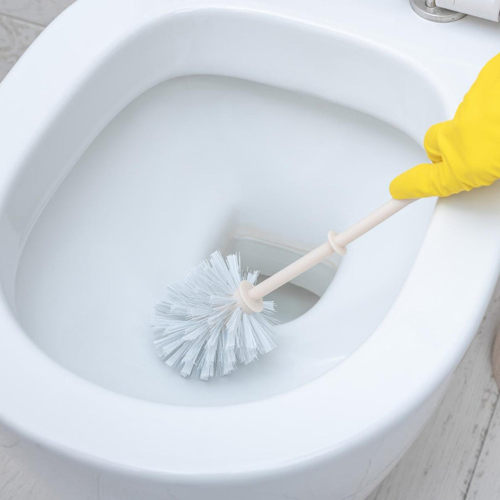 Ergonomic toilet brush designed for deep cleaning Western toilets.