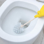 Ergonomic toilet brush designed for deep cleaning Western toilets.