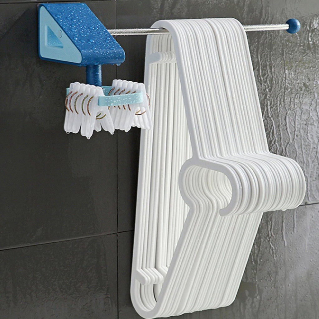 Self-adhesive utensil hooks neatly organizing spatulas and spoons on a kitchen wall.