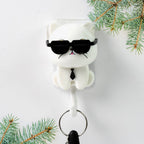 Detailed view of the cute cat face and interactive sunglasses feature on the wall hook.