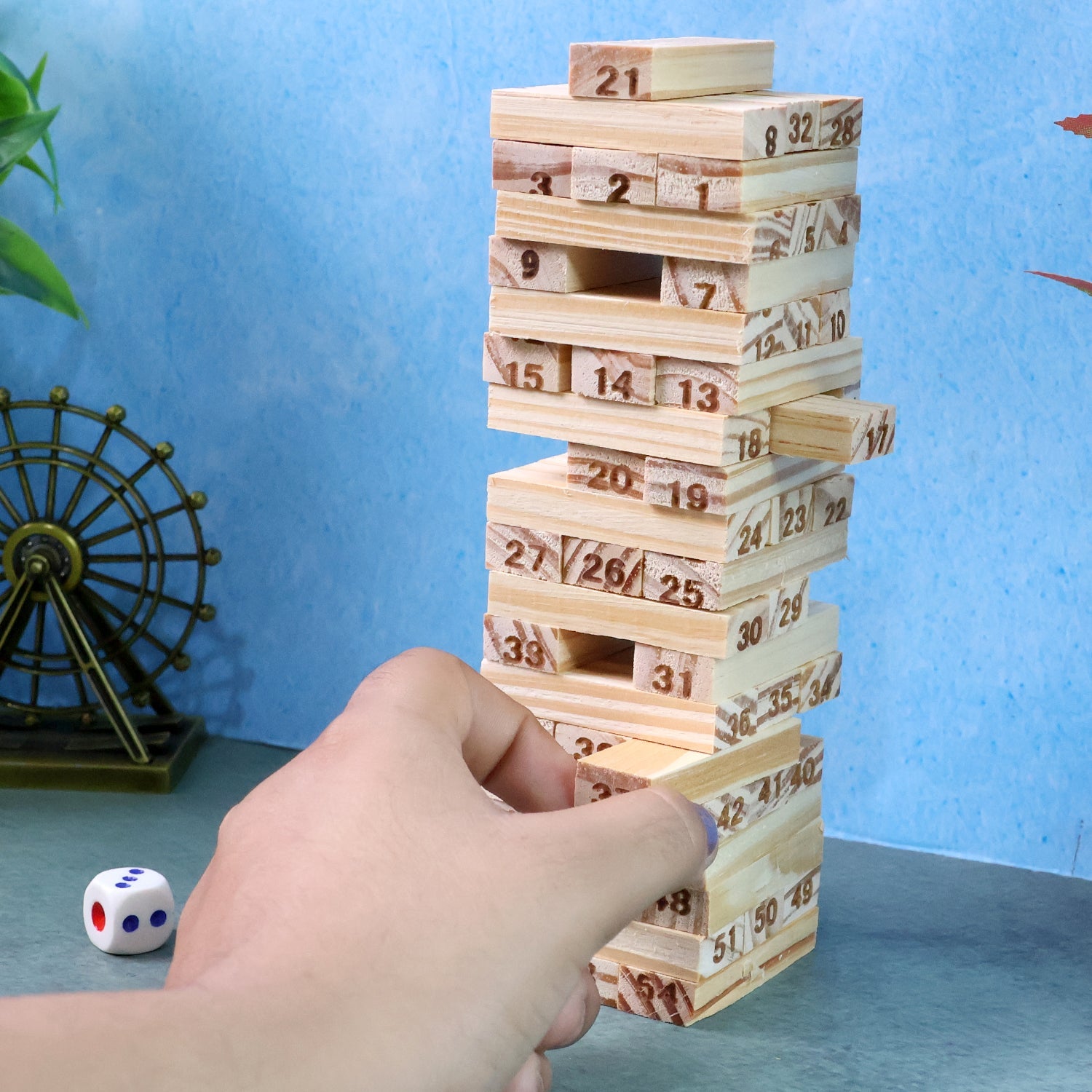Wooden Tumbling Tower Game in progress showing stacked numbered blocks