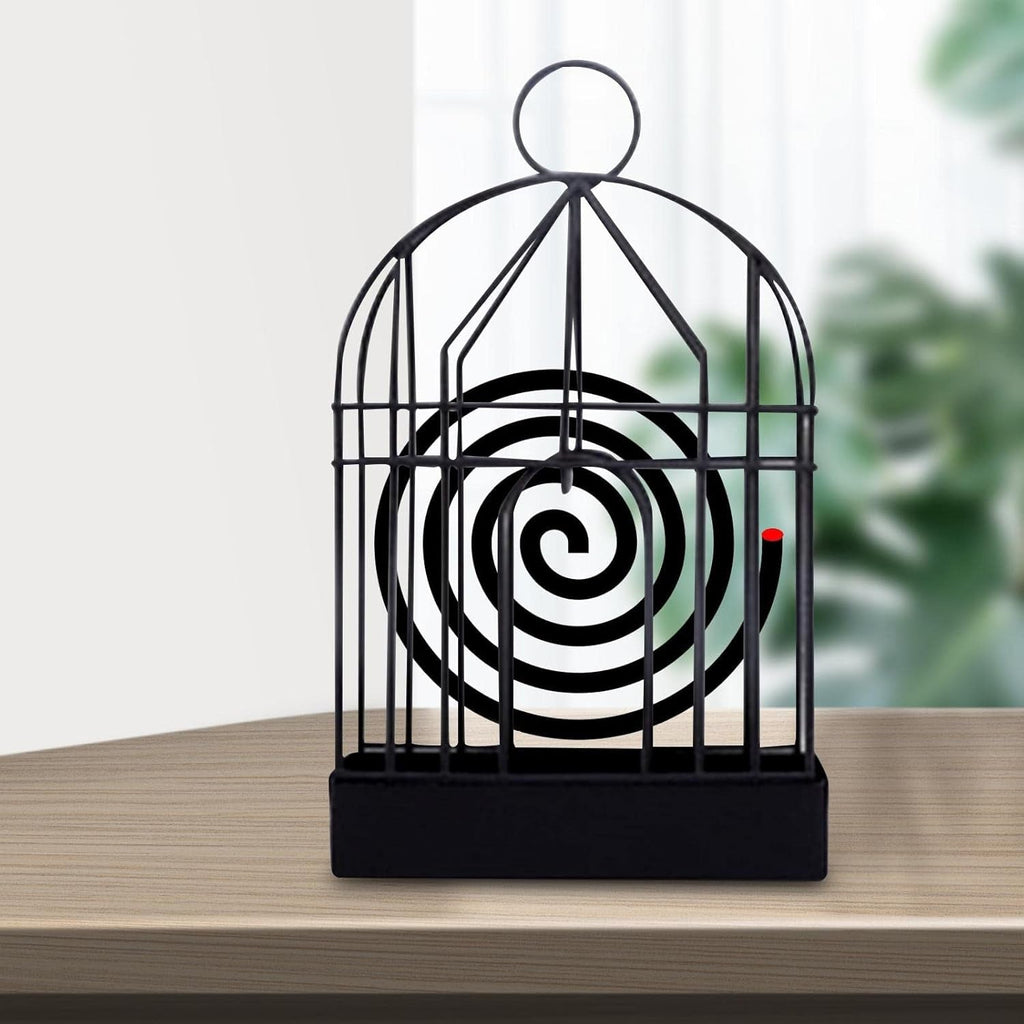 Elegant vintage iron mosquito coil holder with intricate birdcage design.
