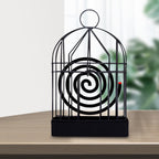 Elegant vintage iron mosquito coil holder with intricate birdcage design.