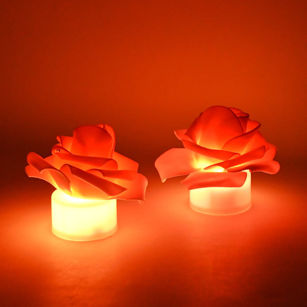 Set of rose flower shaped LED flickering tealight candles glowing warmly