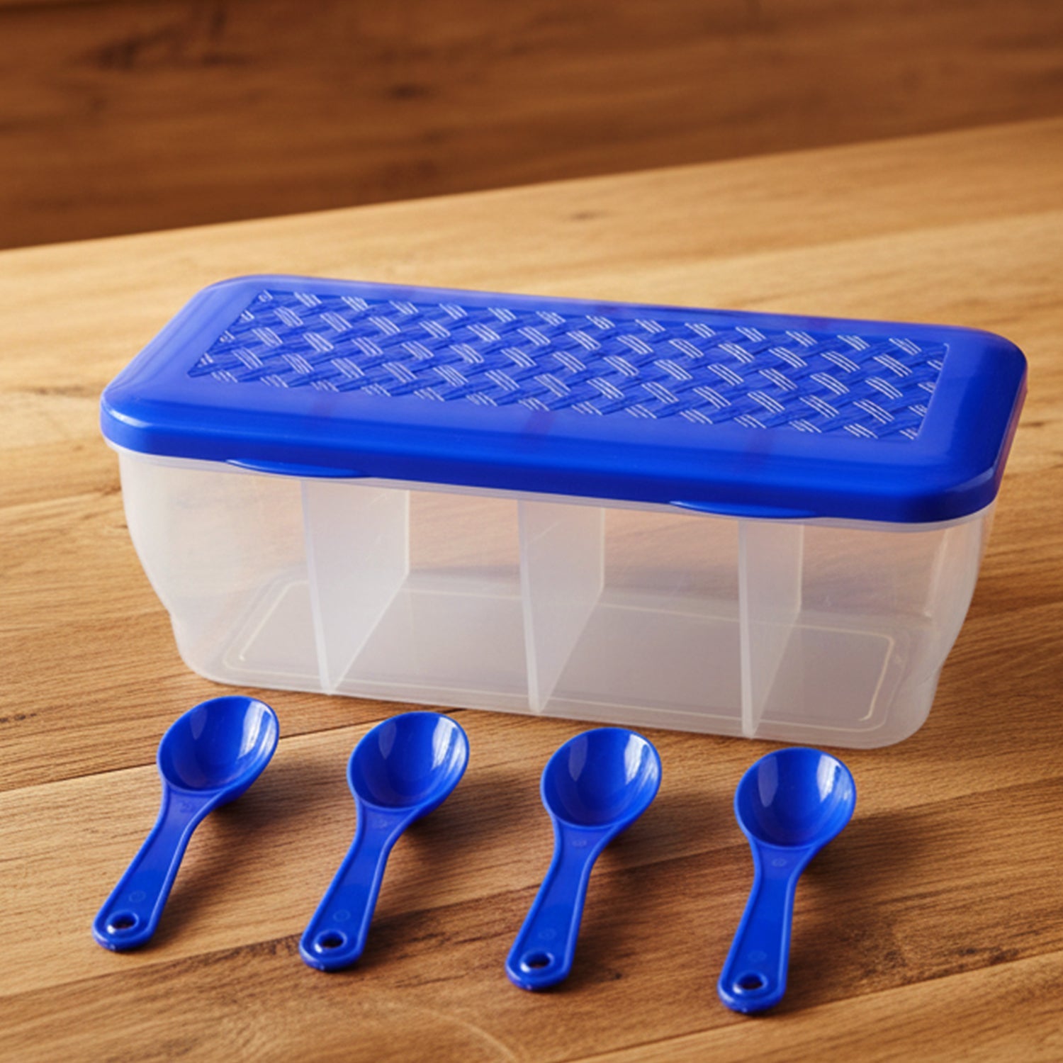 Side view of the transparent 4-section storage container on a modern kitchen counter.