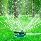 Close-up view of the 3-arm rotating sprinkler's water jets in action.