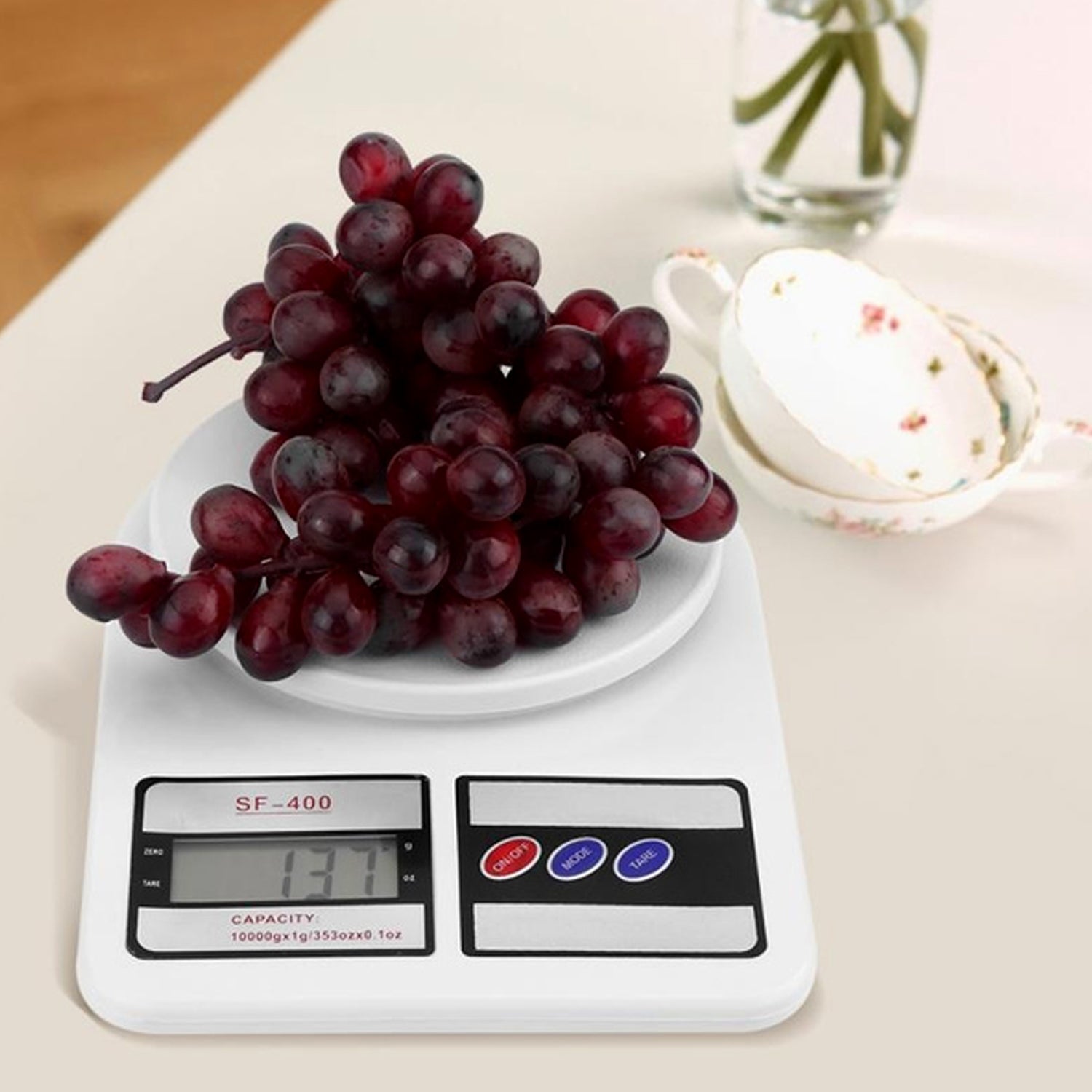 Precision digital kitchen scale featuring the tare function button.
