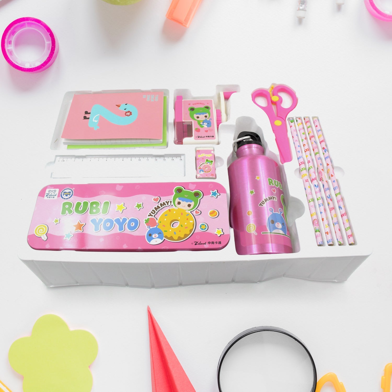 Blue cartoon-themed pencil box and a variety of stationery items for kids.
