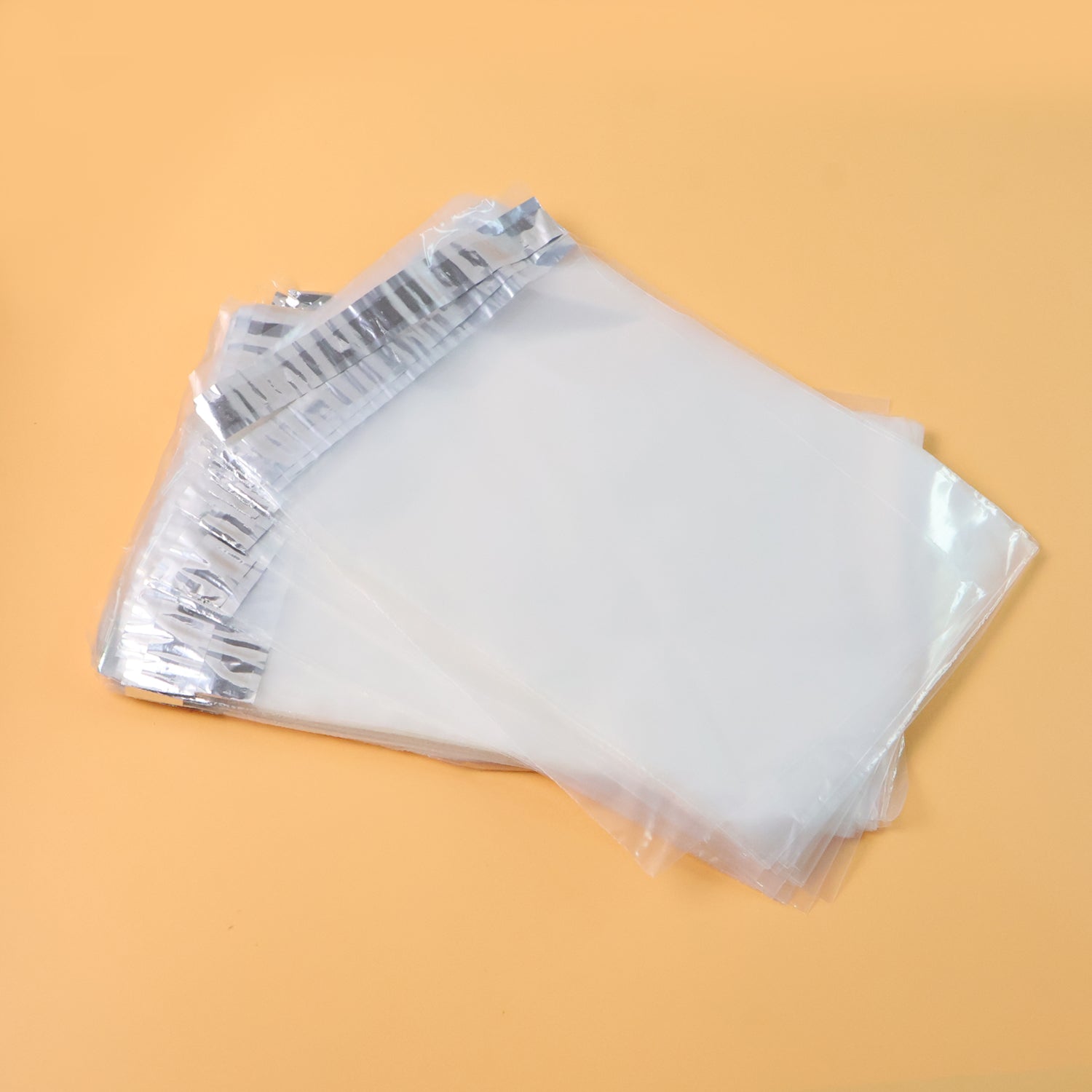 Pack of self-adhesive courier polybags 6.5x8 inch displaying waterproof tamper-proof packaging