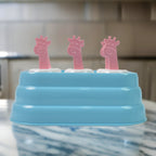 Close-up showing six giraffe-shaped plastic ice mold cavities
