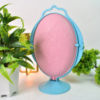 Close-up of reflective fruit dish highlighting mirror surface