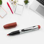 Group of maroon permanent markers arranged neatly on a surface.