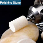 A wool felt buffing wheel in action, polishing a stone surface to a smooth finish.