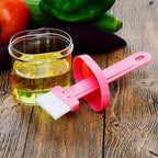 Close-up of the durable plastic spatula with holder, a versatile kitchen tool.