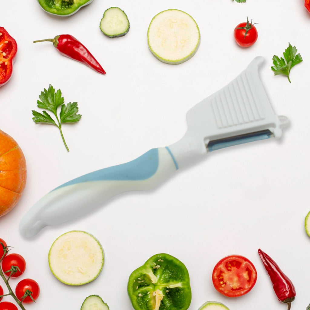 Multipurpose peeler brush showcasing its stainless steel blade and ergonomic handle.