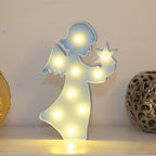 Rear view of the LED angel light, showing its battery compartment and sturdy base.