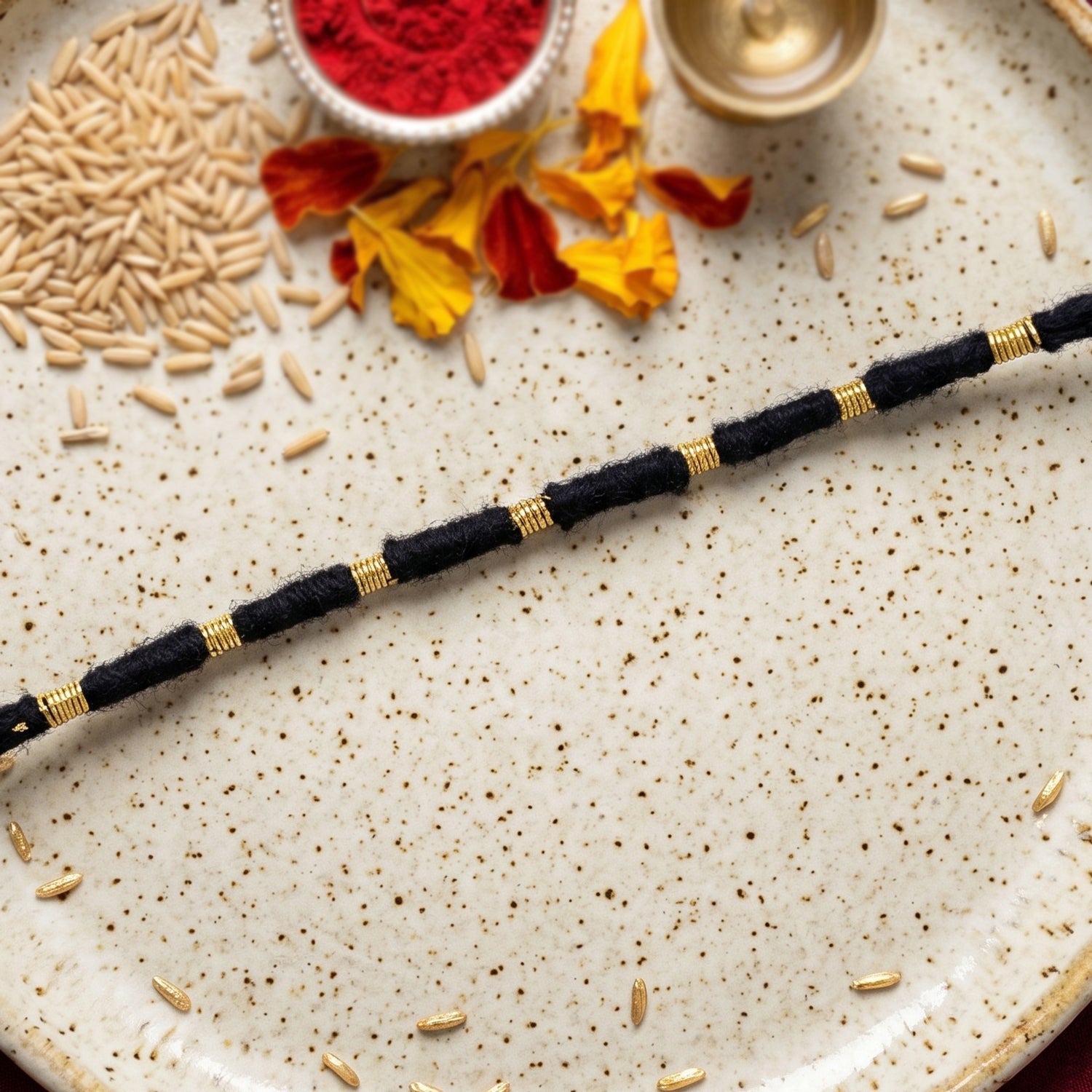 Traditional red rakhi featuring bead and thread work