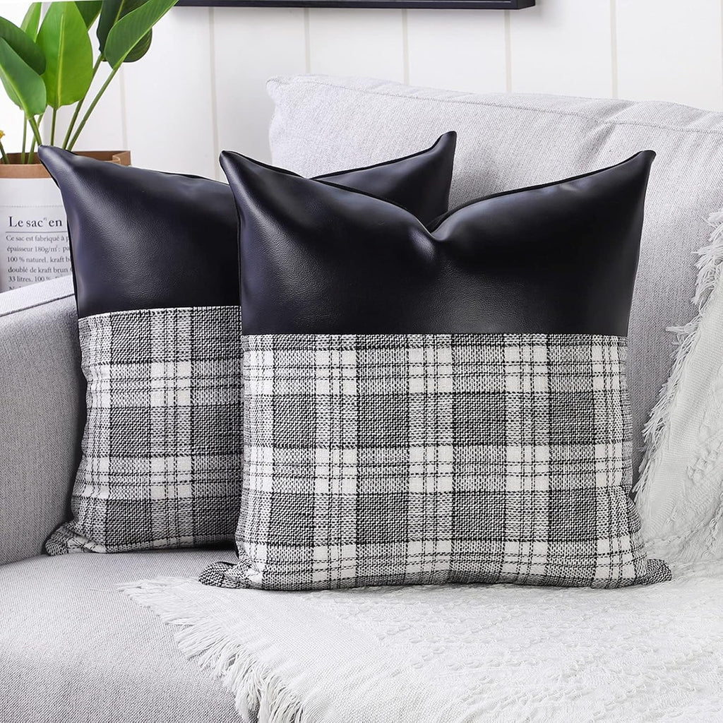 Close-up of a pair of Styleva Leather & Cotton Pillow Covers with elegant texture.