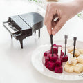 A set of creative piano fruit forks displayed elegantly, ready for delightful snacking.