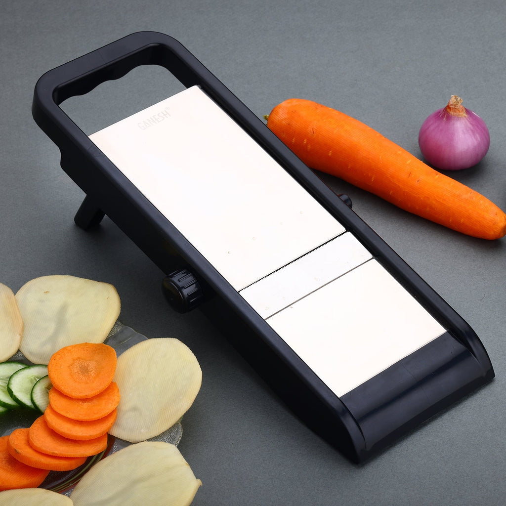 Ganesh vegetable slicer machine with a collection container for mess-free food prep.