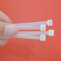 Bundle of 100 black 10-inch nylon cable ties, ideal for heavy-duty cable management.