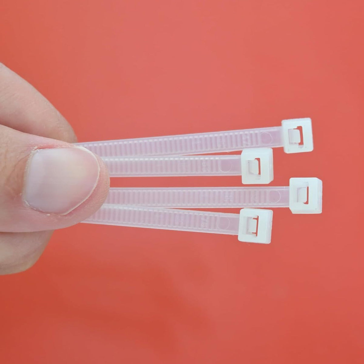 Bundle of 100 black 10-inch nylon cable ties, ideal for heavy-duty cable management.