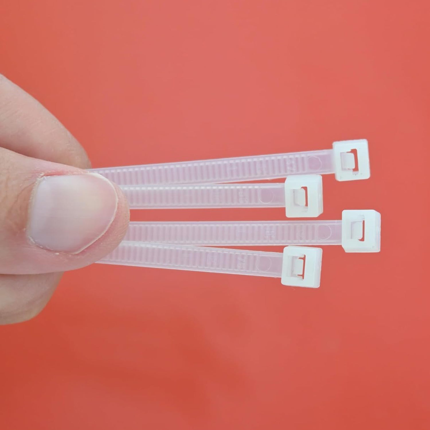 Bundle of 100 black 10-inch nylon cable ties, ideal for heavy-duty cable management.