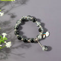 Black and crystal beaded charm bracelet with cloud and rainbow charm