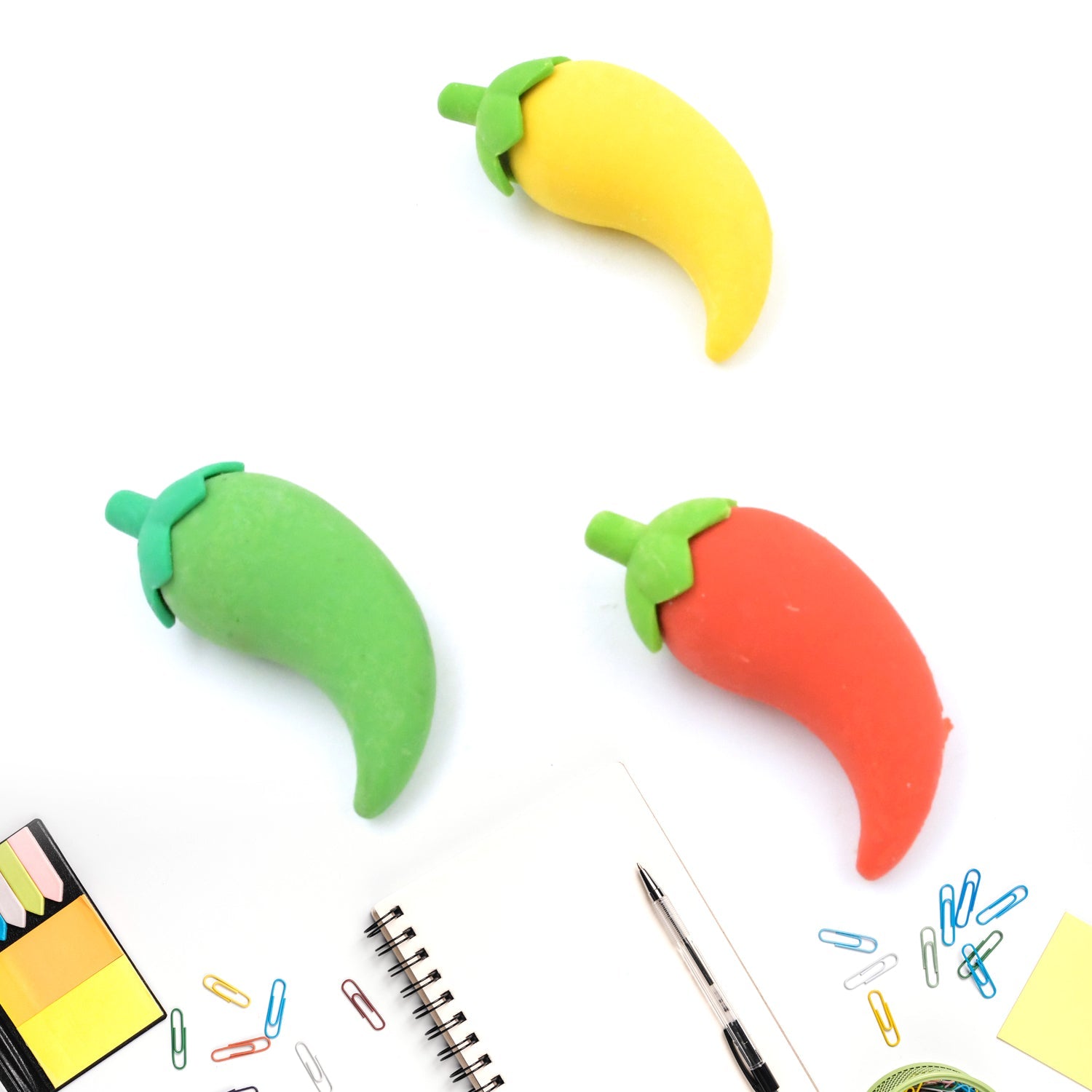 Close-up of assorted vibrant chili erasers, highlighting their detailed 3D design.