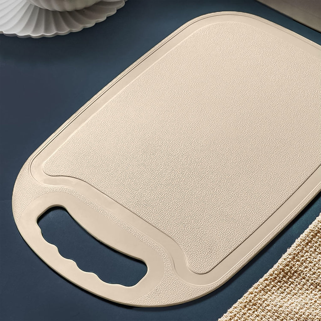 Kitchen plastic chopping board showing smooth surface and handle