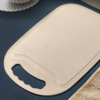 Kitchen plastic chopping board showing smooth surface and handle