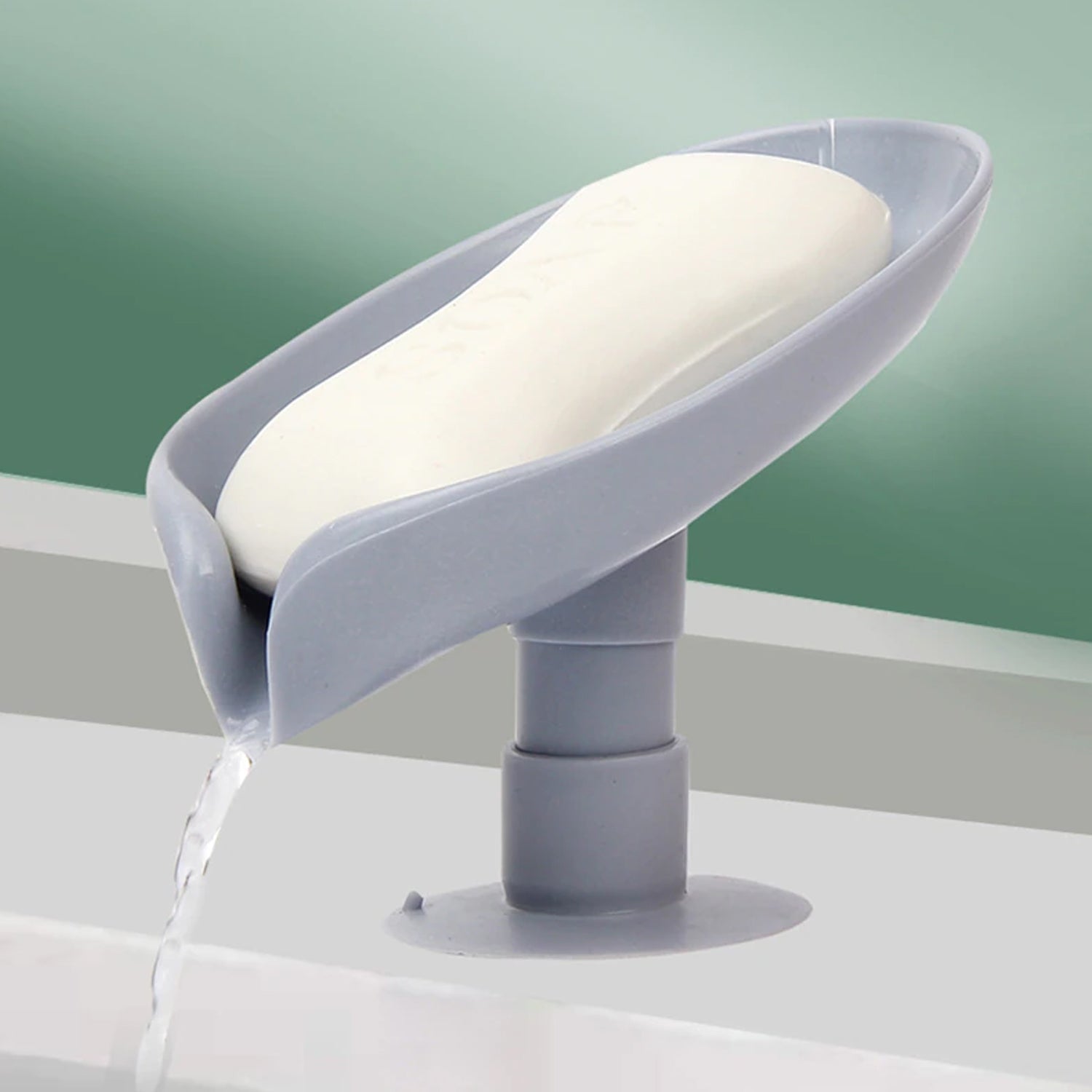 Close-up of the strong suction cup on the leaf-shaped bathroom soap dish, ensuring stable placement.